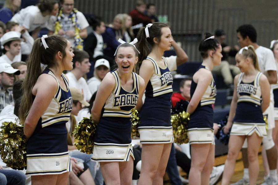 Cheerleaders Ayana Shores ('19) and Courtney Evanger ('19) make the best out of Friday nights game against Lake Stevens. 