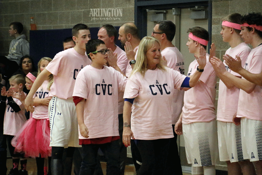 Arlington boys basketball supports their teammate Dylan Beakleys (18)  grandmother for being cancer free for many years. 