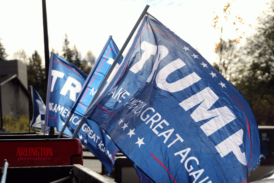 Trump+supporters+proudly+fly+their+flags+in+AHSs+student+parking+lot