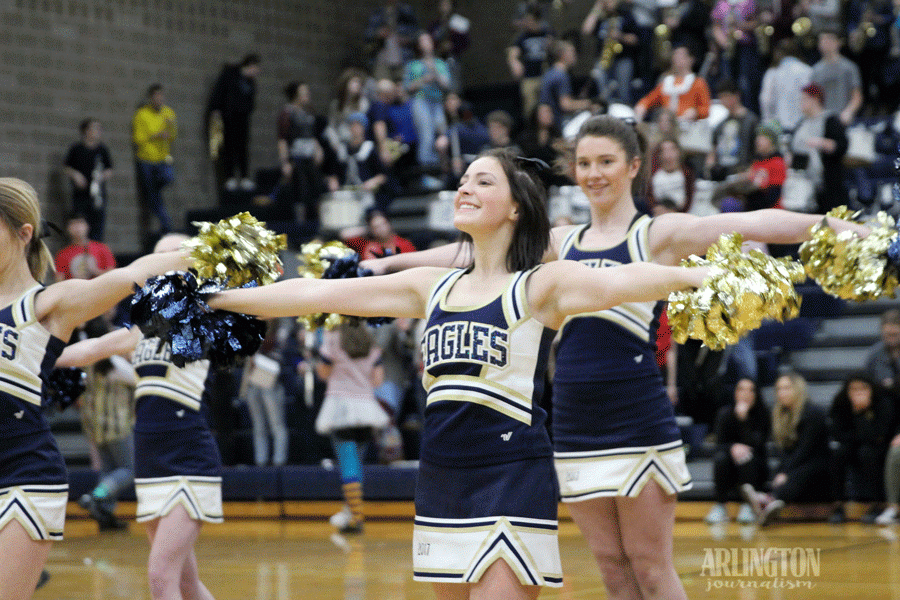 Shailyn Berry ('17) and Hannah Flick ('17) pumps up the crowd during half time of the Varsity Basketball game.