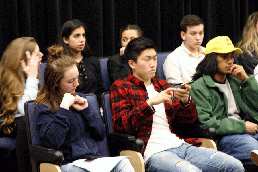 Paul Chung (19) texts on his iphone six during six period beginning theater arts. 