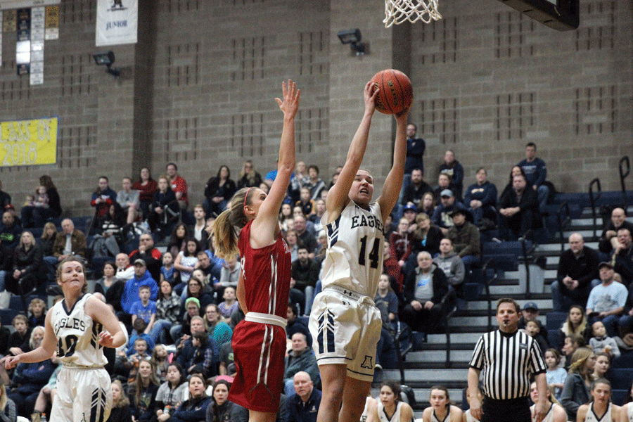 Peyton Brown (18) rebounds a basketball in the game against Stanwood on January 27, 2017. Brown advises her middle school self to get in the gym more, get to the rim, and become more than a three-point shooter. 