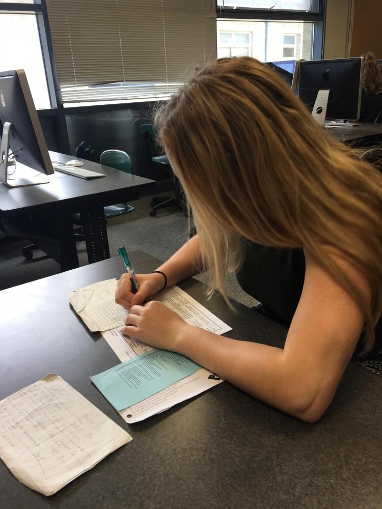 Jessica Abraham (17) writing tips for a sophomore preparing for the SBAC.