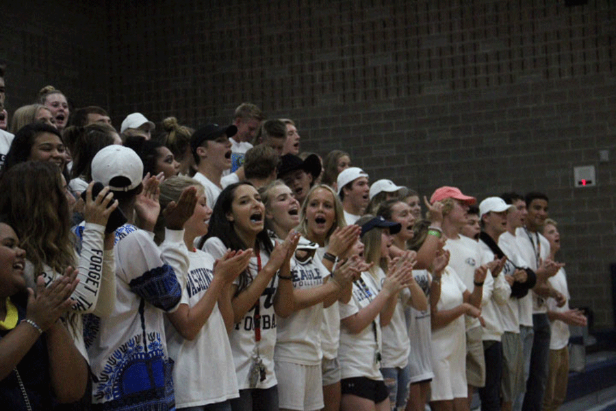 The AHS student section cheer on their volleyball eagles on Tuesday, September 12, 2017. The students were loud, proud, and positive for their classmates in the game.