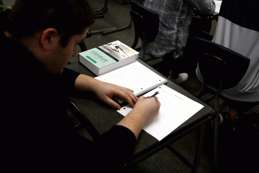 Cody Barschaw works on a assignment for AP Calculus.