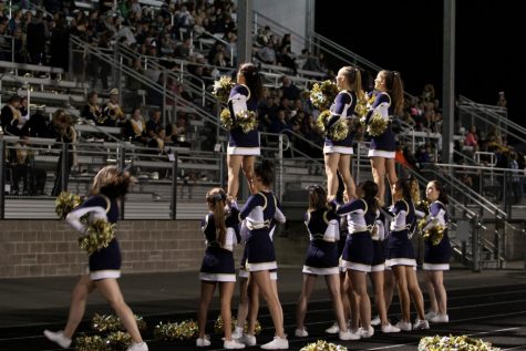 The Arlington Eagle cheerleaders preforming at the Sept. 8 game hypng up the game while we fought a difficult game against the Lake Stevens Vikings. 