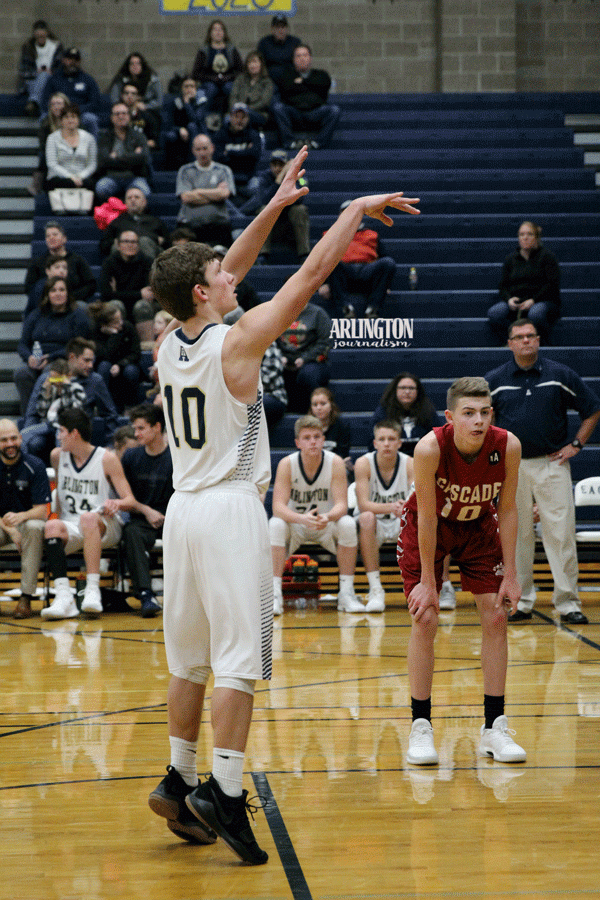 Anthony Whitis (19) shoots a free throw at the varsity basketball game against Cascade High School