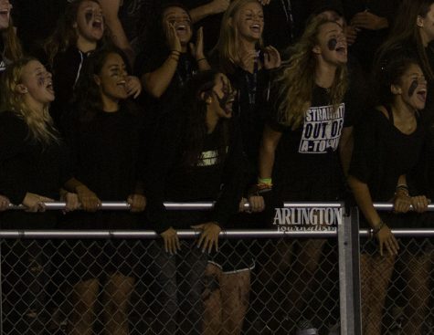 The senior section cheers on the varsity football team at the first home game of the year
