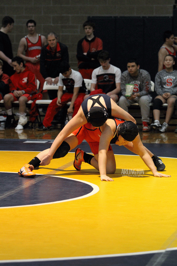 Wrestling in an exhibition match, Itzel Ceja (18) takes on a Snohomish wrestler.