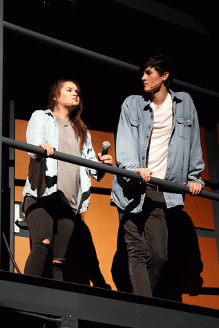 Alyssa Hutchens (11) and Alec Villa (11) stand on the side catwalk acting angry for their roles in this years Medley production, titled Saturday Night Lies. 