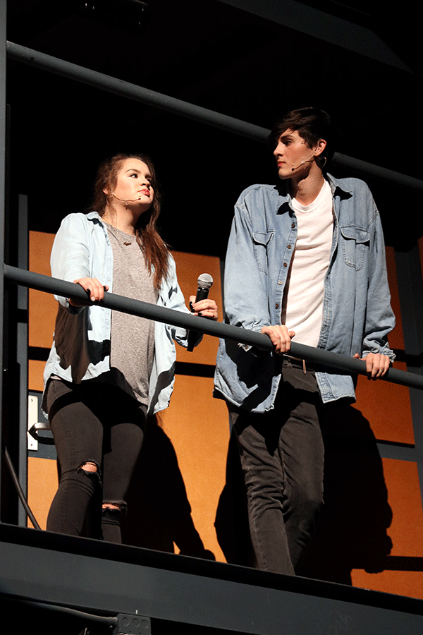 Alyssa Hutchens (11) and Alec Villa (11) stand on the side catwalk acting angry for their roles in this years Medley production, titled