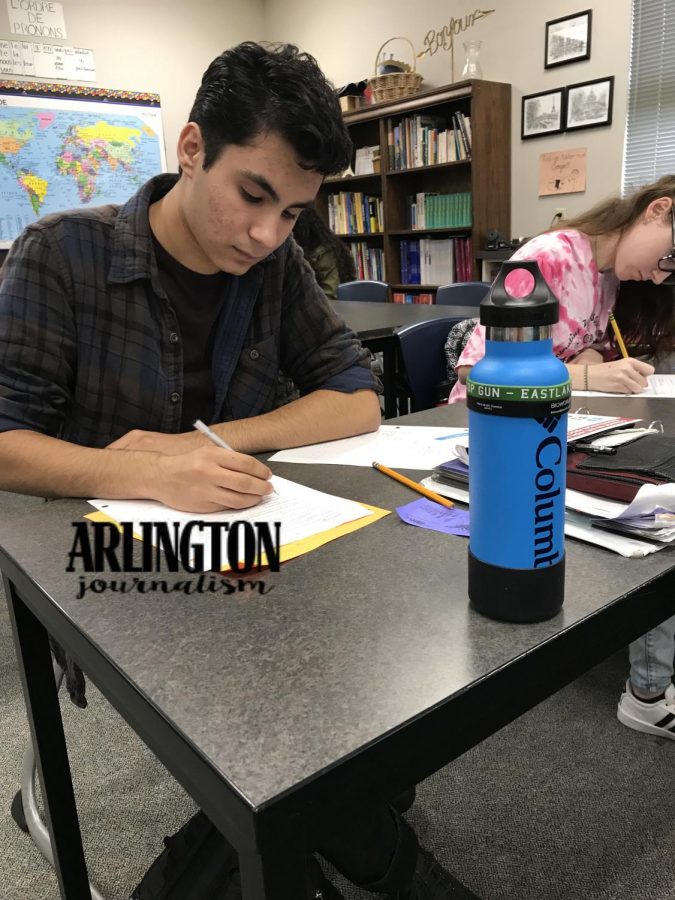 Naveed Arang (11) practices his irregular verbs in French 3. Studying for french class has been apart of Arangs school routine since freshman year.