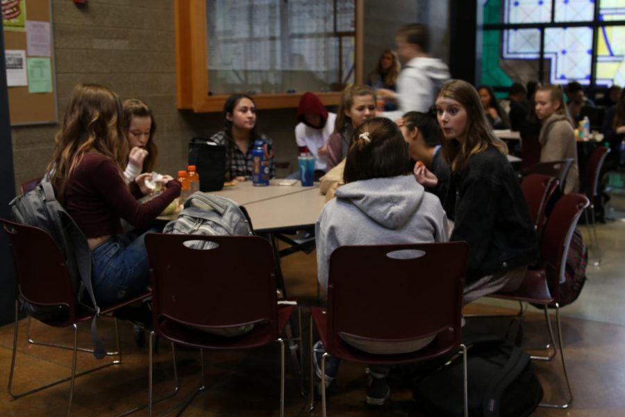 freshman Taylor Chapman,Trinity Chapman and sophomore Amari Garrissey and Madison Wallace sit at third lunch and talk about what is going on in their lives. 