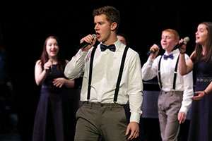 Andrew Smith (12) singing a solo during the Winter Choir Concert last monday. 