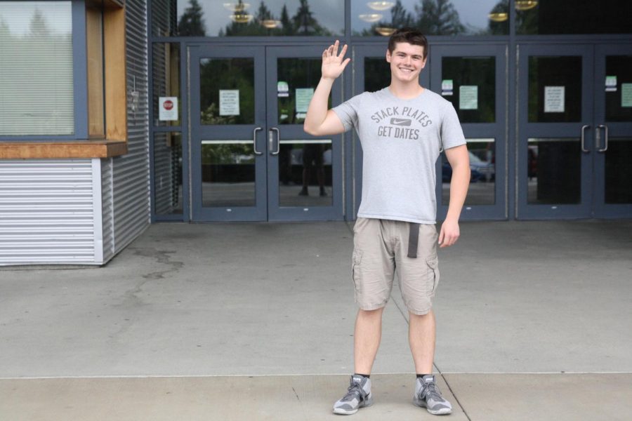 Senior Michael Cox waves good-bye to Arlington High School