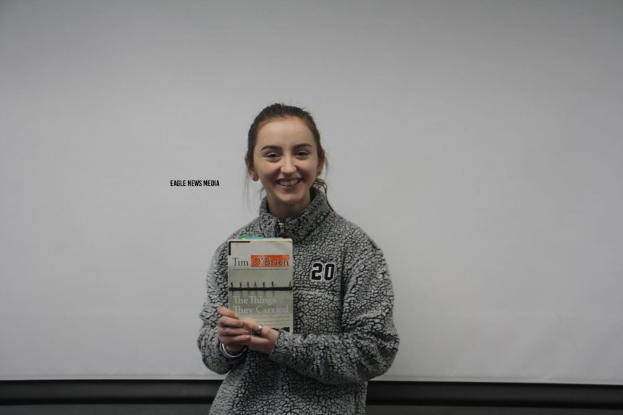 Ivy Ewing (12) shows off her favorite book The Things They Carried by Tim OBrien.