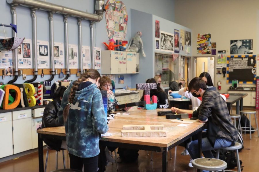 students working on an art project.