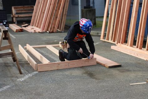 A student is seen connecting wooden boards for Skills USA competition on Jan. 27. 
