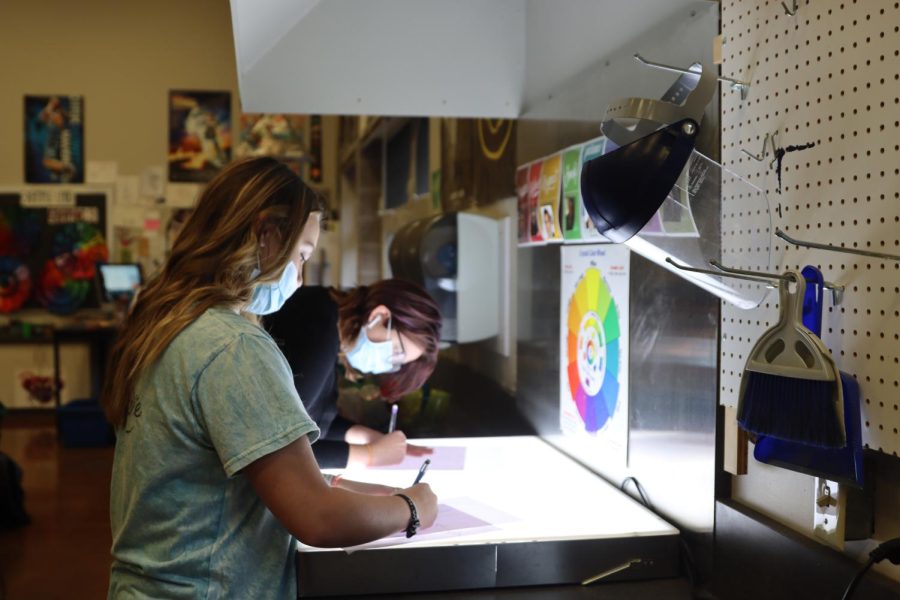 Students are seen tracing images using a light panel on Nov. 8. 