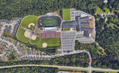 An above view of AHS, showing the student parking lot right of the fields. From Google Earth. 