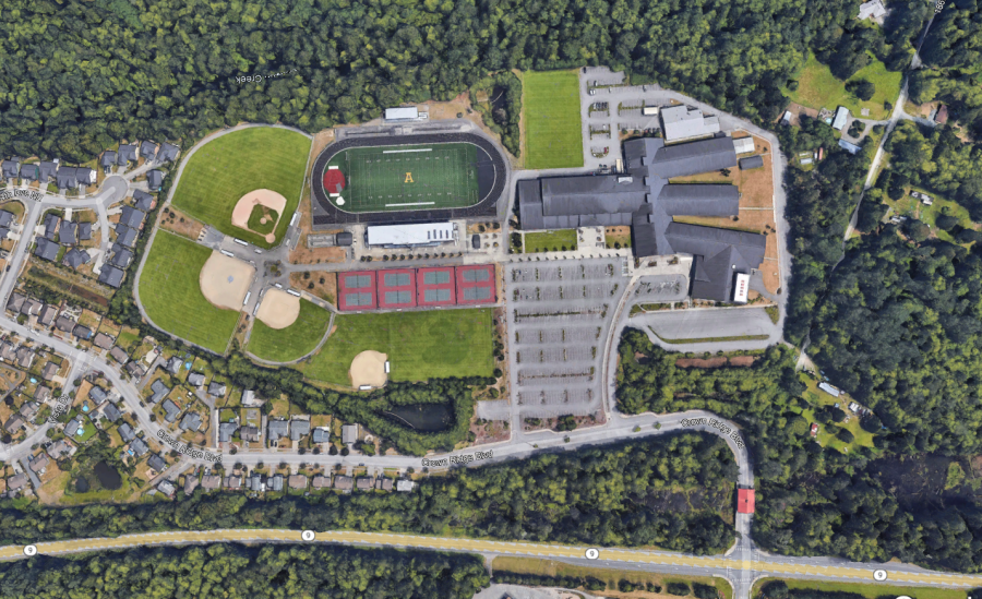 An+above+view+of+AHS%2C+showing+the+student+parking+lot+right+of+the+fields.+From+Google+Earth.+