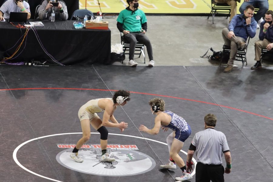 Sophomore Dustin Baxter wrestles teammate junior Eric Vogel at the state tournament in February. Baxter took 3rd. 