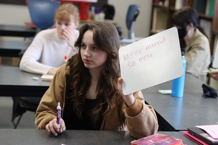 A student is seen with a whiteboard in french class on April 22. 