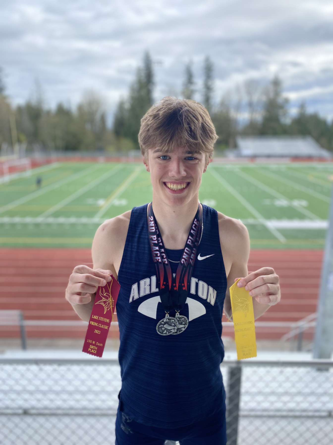 Junior Dallas Miller shows off his ribbons from the Viking Classic, a meet in Lake Stevens. 