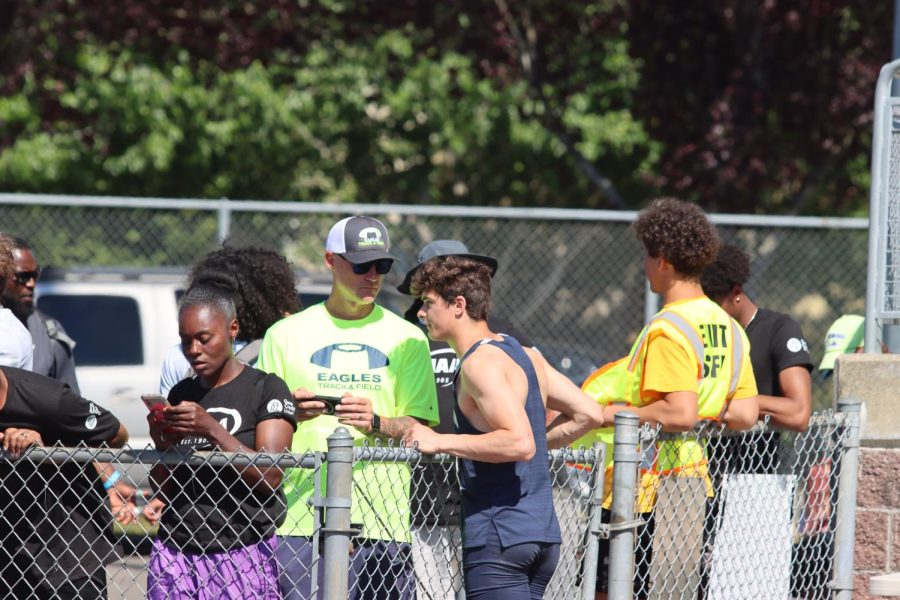 Ryan Rushton, shown here talking to Coach Hunter at the WIAA State Championships, won the Washington State Combined Events Championship.