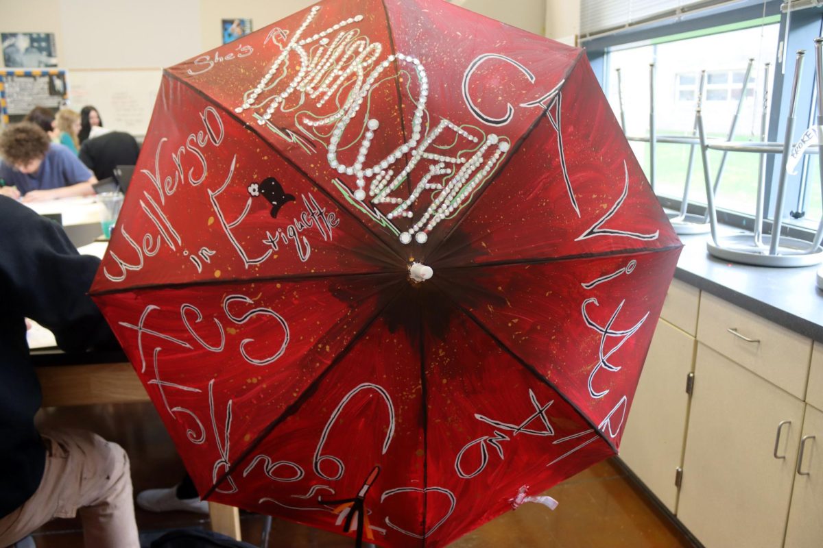 A graphic arts three project involves painting an umbrella. 