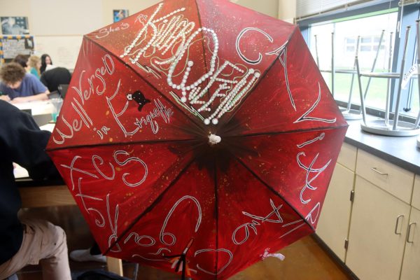A graphic arts three project involves painting an umbrella. 