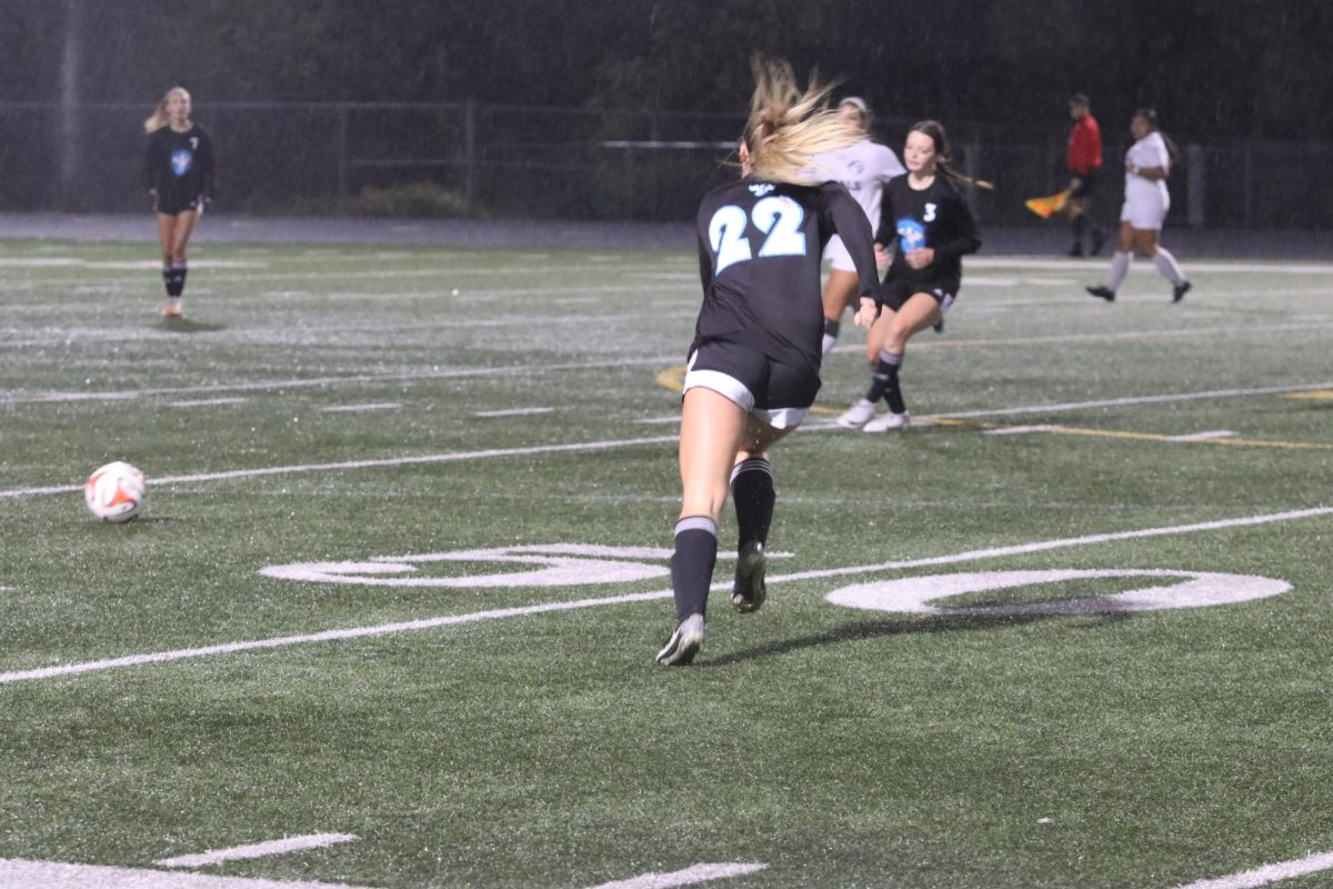 Jersey Walker (25)  chases after a ball to continue down the field to try and add to her goal count of 3 this game.
