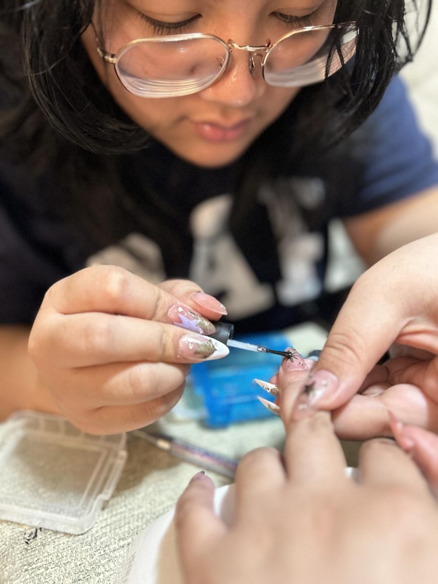 Creating a new nail design, Josline Contajioso (‘24) has a passion for doing nails. Contajioso started up her own nail business in the hopes of learning more about entrepreneurship.