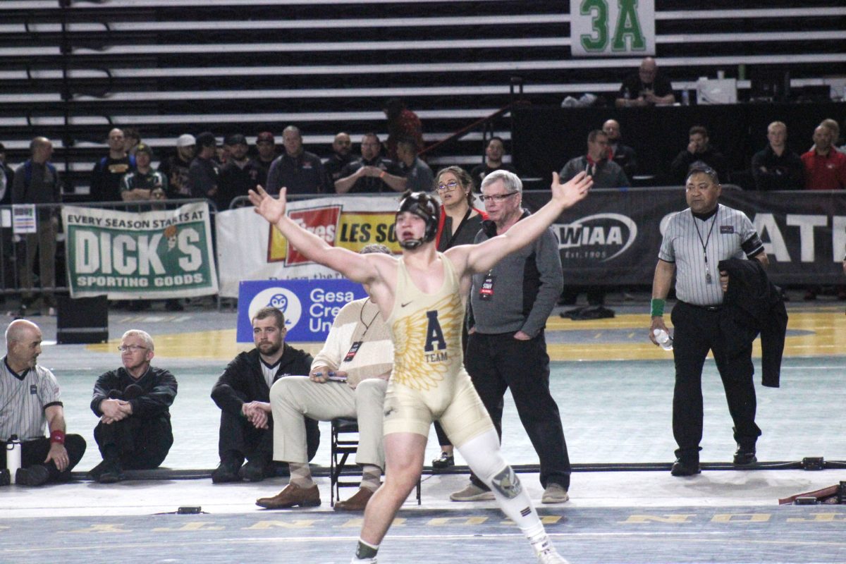 Senior Dustin Baxter goes into triple overtime in the State championship. “Im a state champion,” said Baxter. 