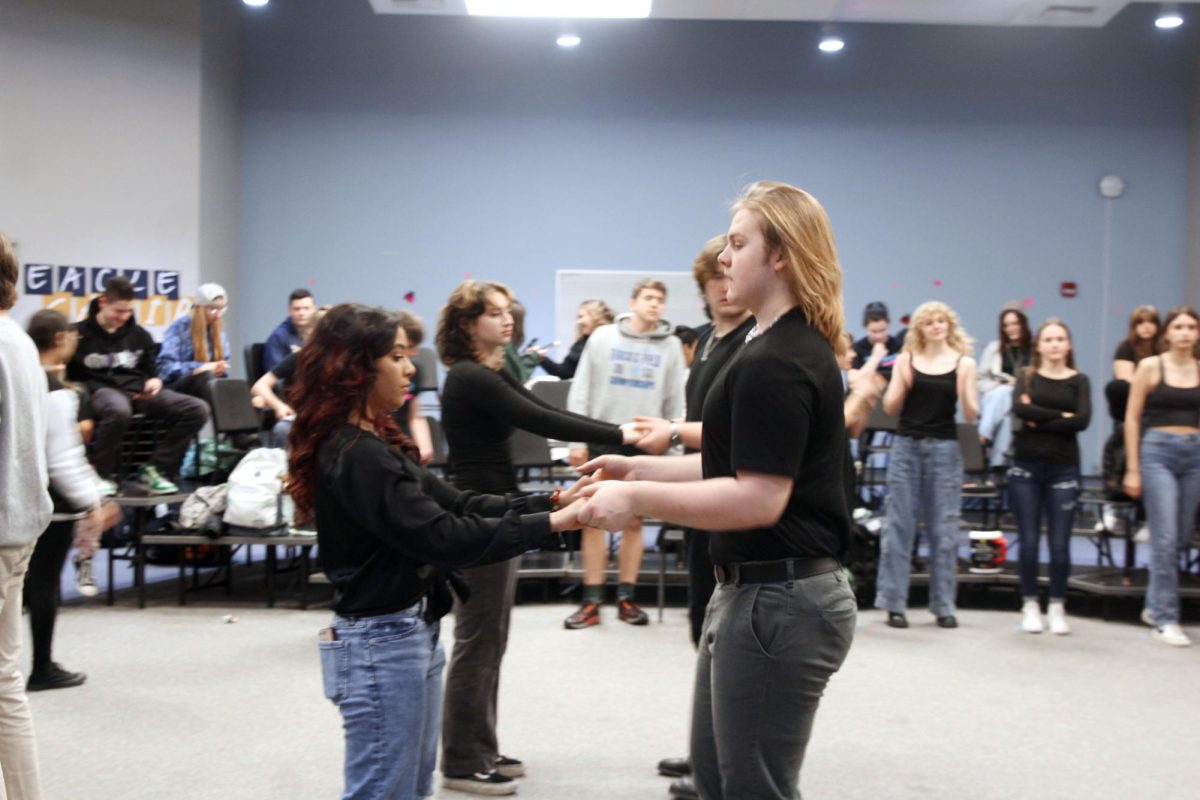 Kohl Hubbard (26) and Mariska Lebahn (24) are swing dancing while practicing their final number for Footloose, at rehearsal after school on February 13.
