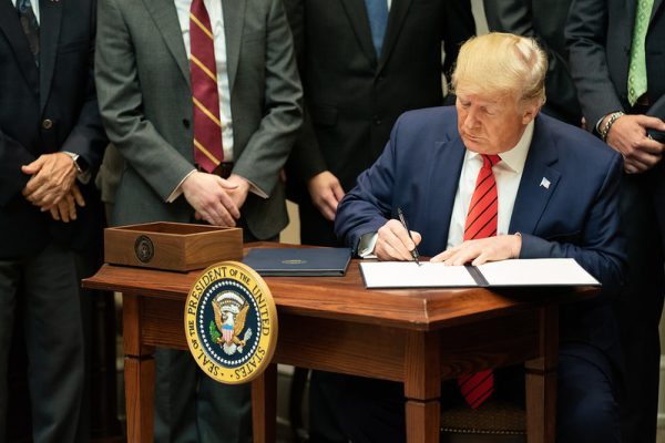 President Donald J. Trump signs Executive Orders on Transparency in Federal Guidance and Enforcement Wednesday, Oct. 9, 2019, in the Roosevelt Room of the White House. (Official White House Photo by Shealah Craighead)