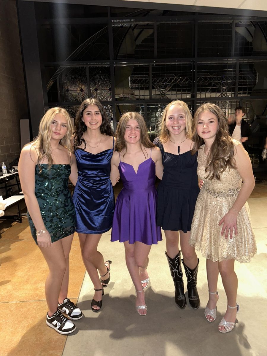 Alyssa Gelow, Stella Hyde, Iylee Belisle, Adalyn Smith, Peyton Parsons posing for a photo at the TOLO dance.