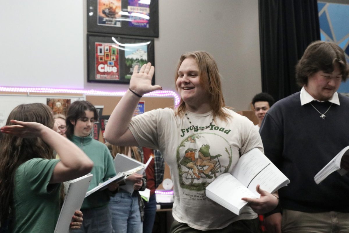 Bayleigh Ivester (12) and Kohl Hubbard (11) high five during a musical rehearsal February 11.  Ivester and Kohl are performing on opposite nights; Hubbard is part of the Sapphire Cast, and Ivester is part of the Ruby Cast 