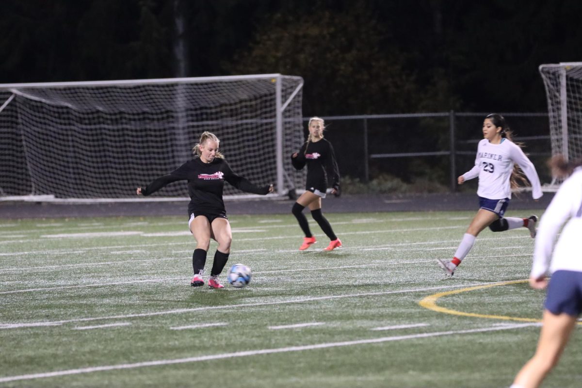 Brooklyn Hart (12) takes control of the ball. 