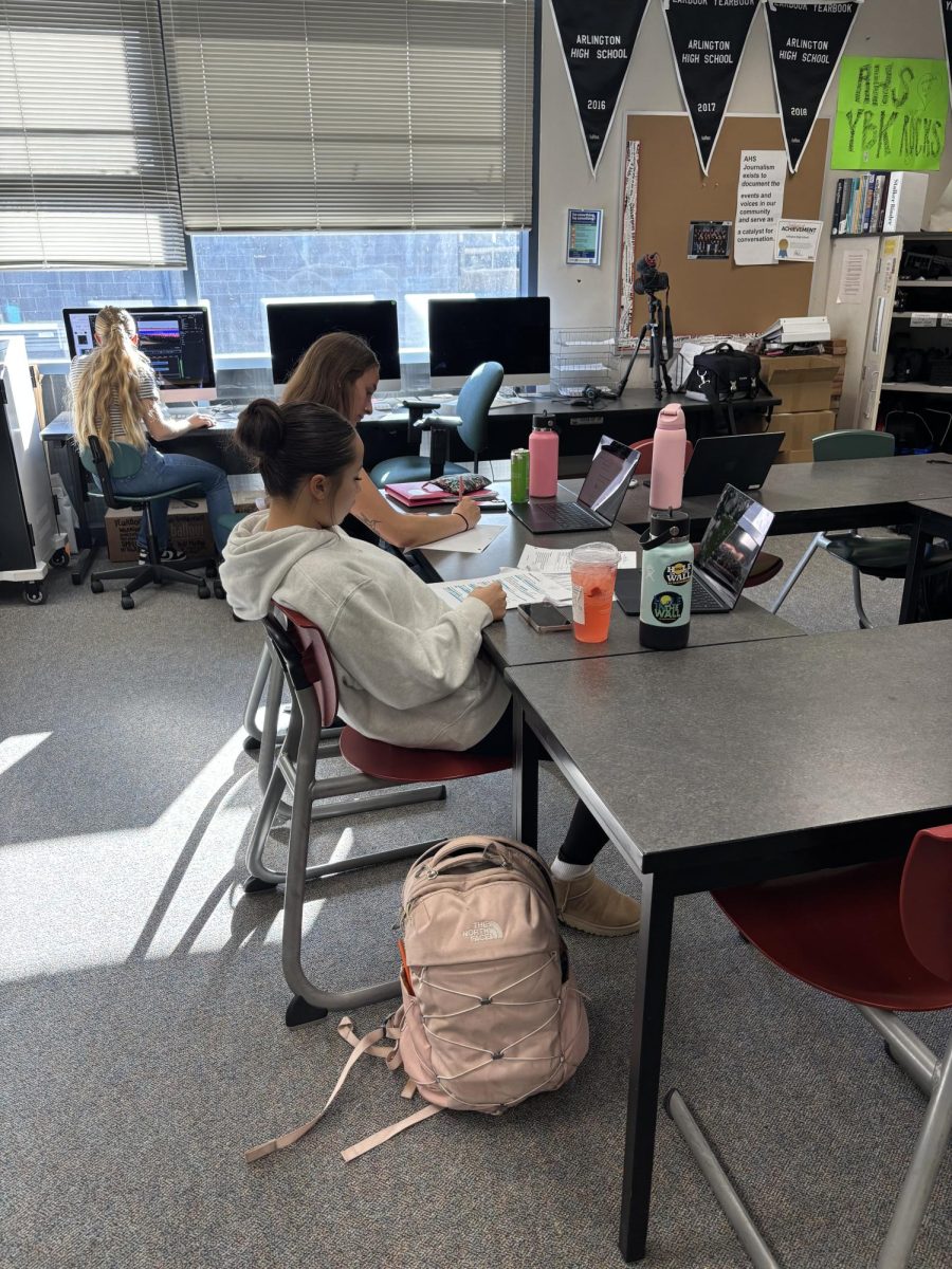 Chloe Falk and Amelia Potong working on their major stories this week. 