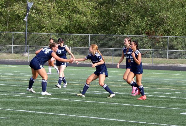 Aunna Felchlin (9) and Ellie Linklate (10) high five each other during the home opener on September 6, 2025. The JV team lost the game against Mountlake Terrace 2-1. 
