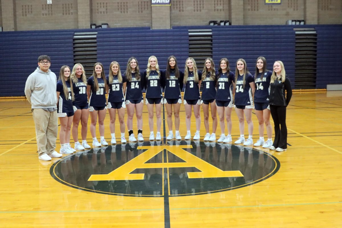 AHS Girls Basketball Manager Adrian Fabian ('26) (far left) is alongside the 2024-25 AHS Girls Basketball Team.