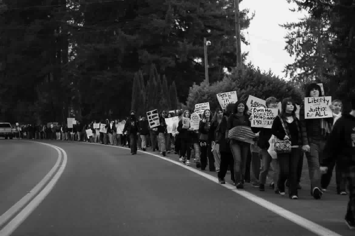 Students from Marysville-Pilchuck HS walking out towards State Ave. on Shoultes Rd. to protest about current immigration policies & enforcement.