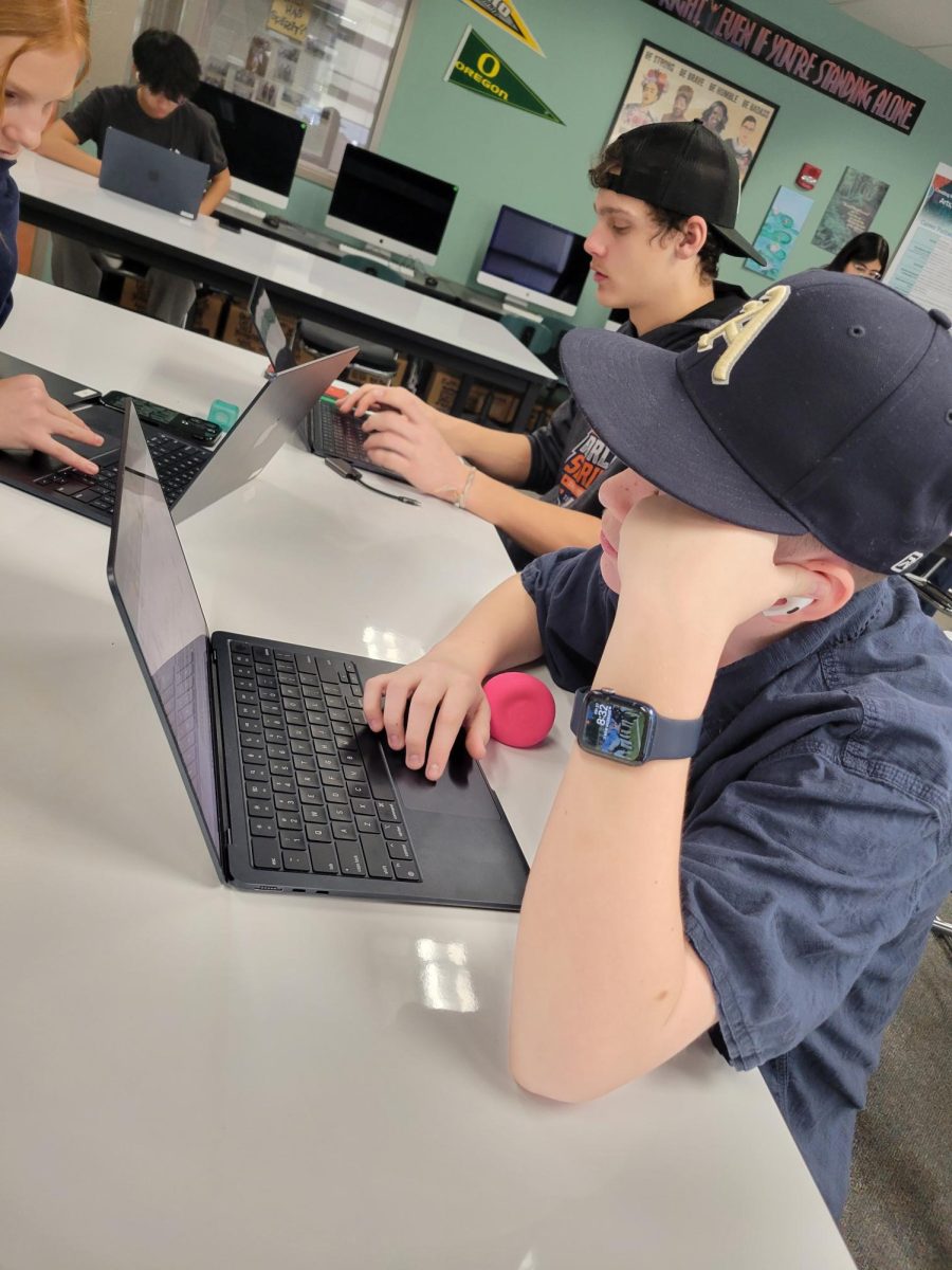 Two students taking the SBAC on their laptop 