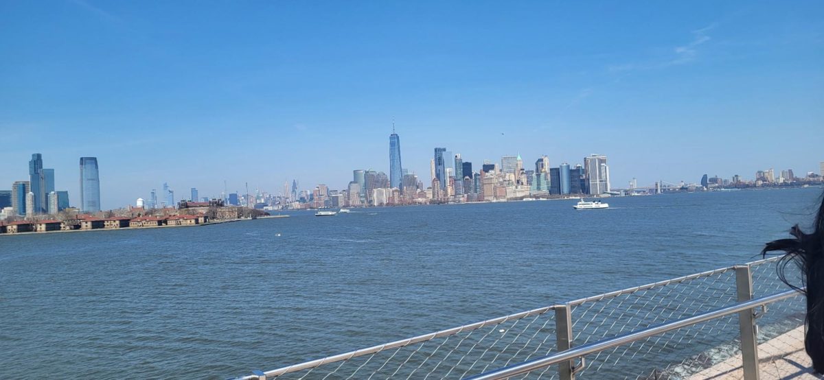 This is a picture of New York. The band was on the ferry to go to Ellis Island. 