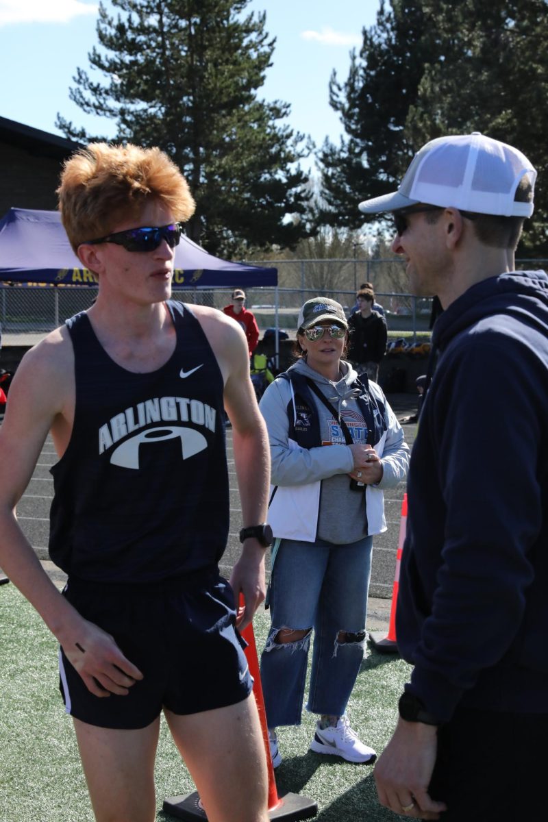 Derek Salmon meeting with coach Murry after running a great 800 on March 24 2026.