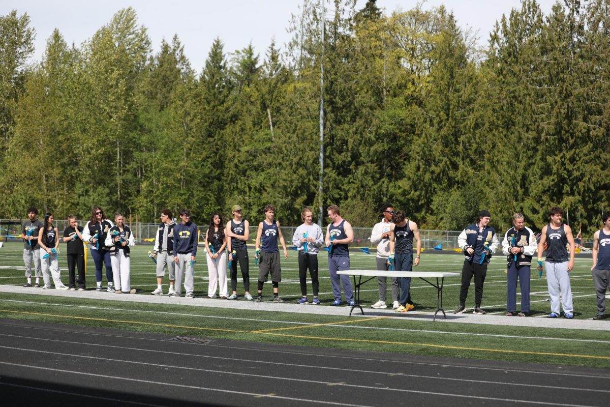 Senior track athletes getting athletic recognition during Senior Night. 