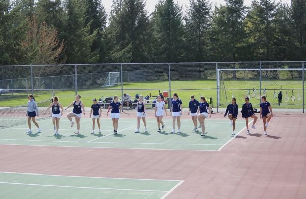 Reaonna Rice (26') captured this photo during an Arlington High School girls tennis match when the players were warming up.